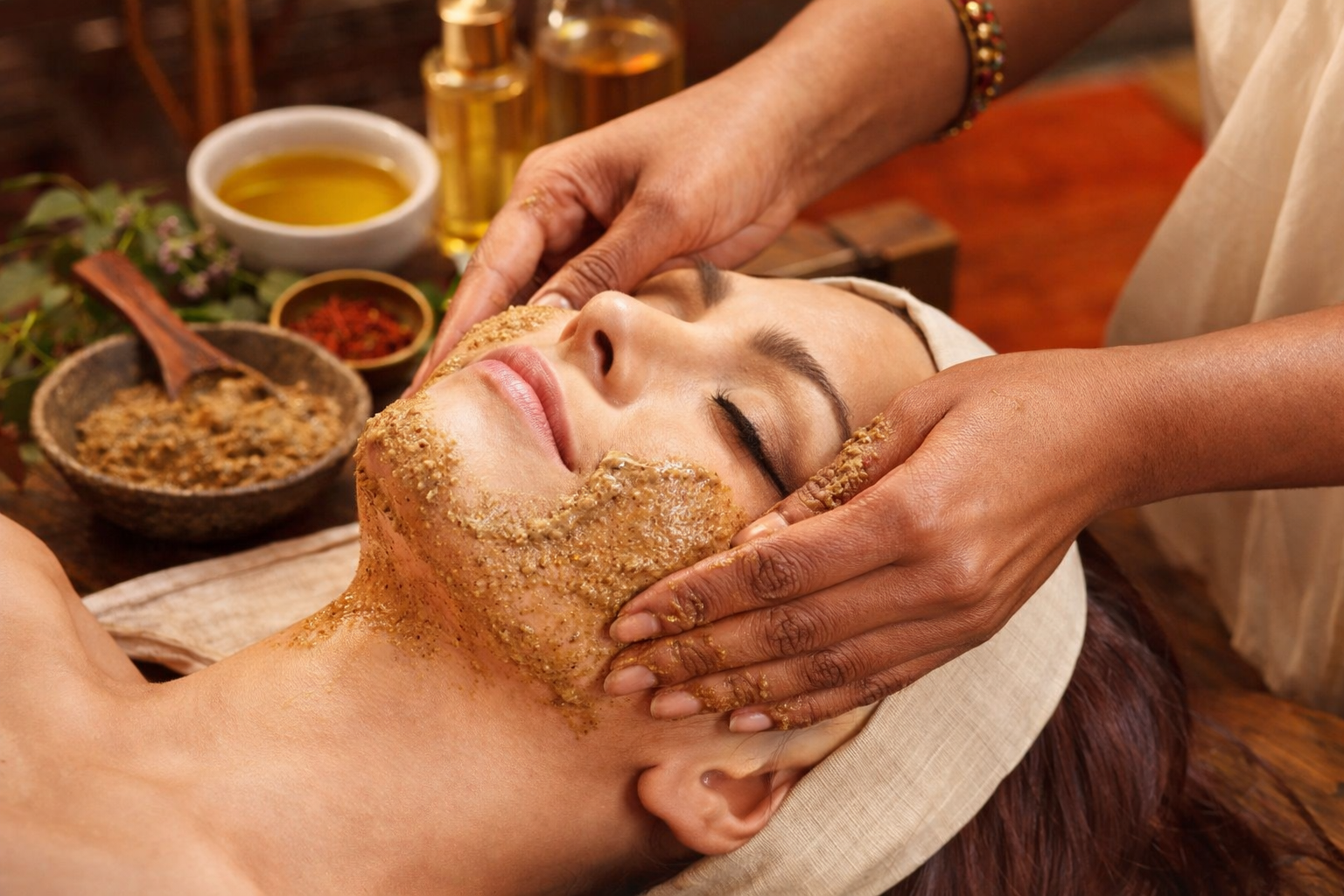Woman applying Lumière Éclat Ayurvedic serum for radiant skin